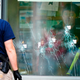 Investigators work at the scene of a terrorist shooting at a supermarket in Buffalo, New York on May 16, 2022.
